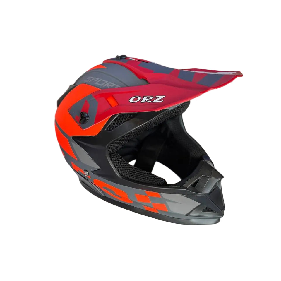 Red and black helmet with 'OFZ' branding on a display surface.