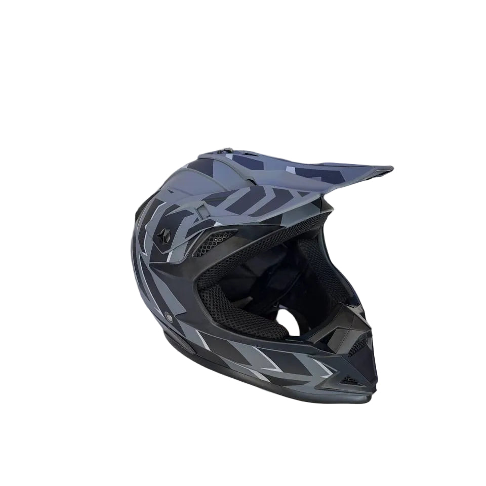 Black and gray helmet on a counter with product packaging in the background