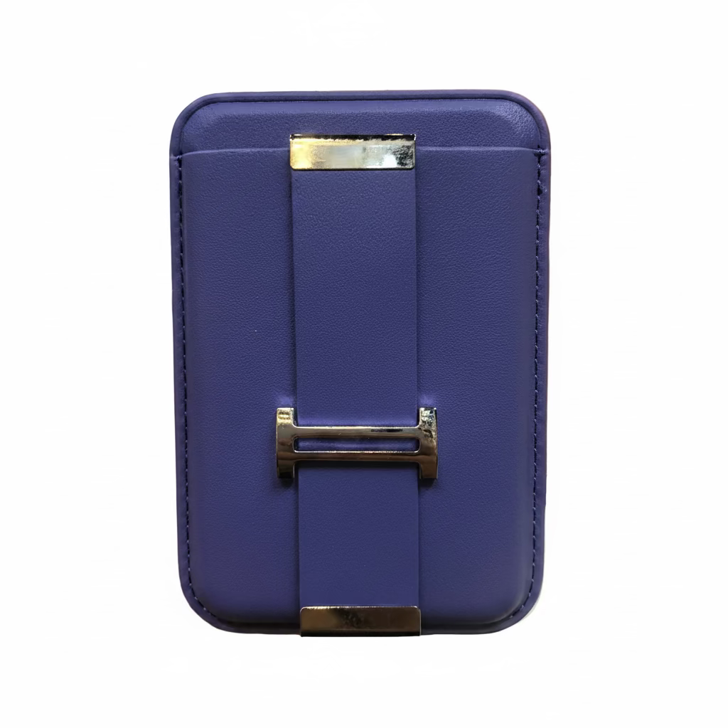 Purple wallet with gold clasp held in a hand against an office background