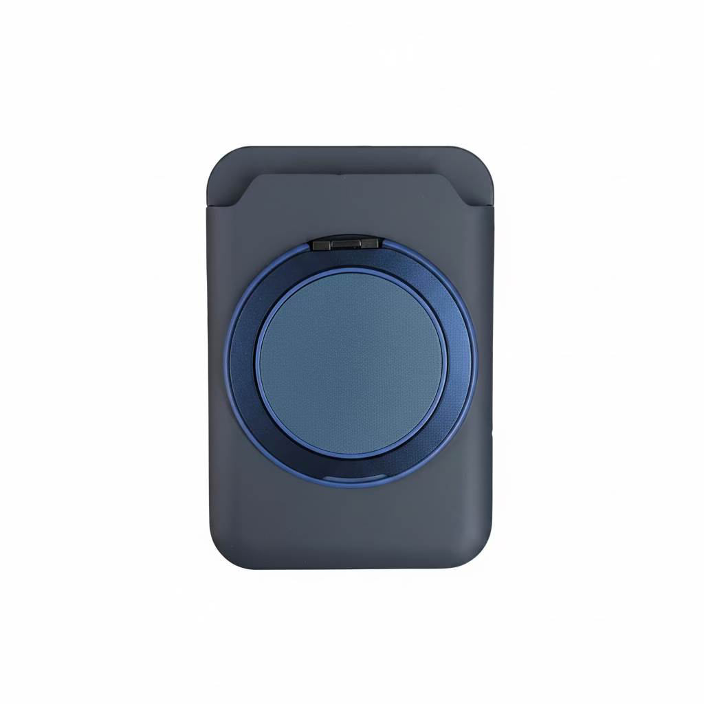Hand holding a blue and black circular device against a blurred background