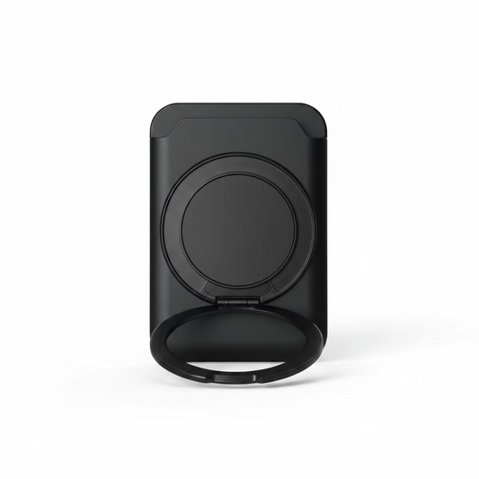 Black phone holder on a desk with a laptop in the background